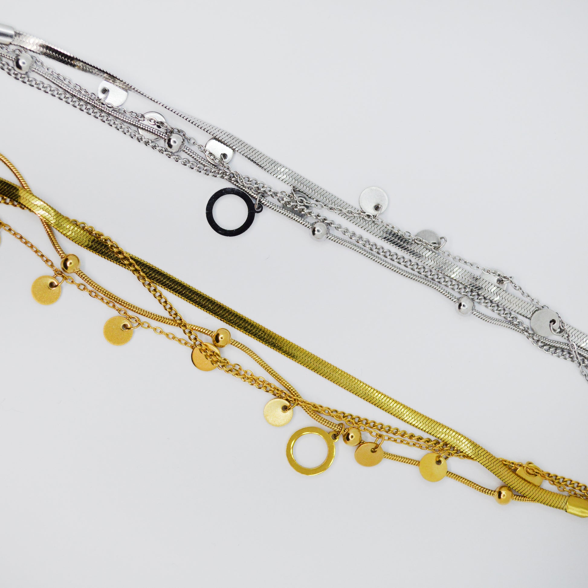 Večplastna zapestnica Orbit iz nerjavečega jekla v zlati in srebrni barvi