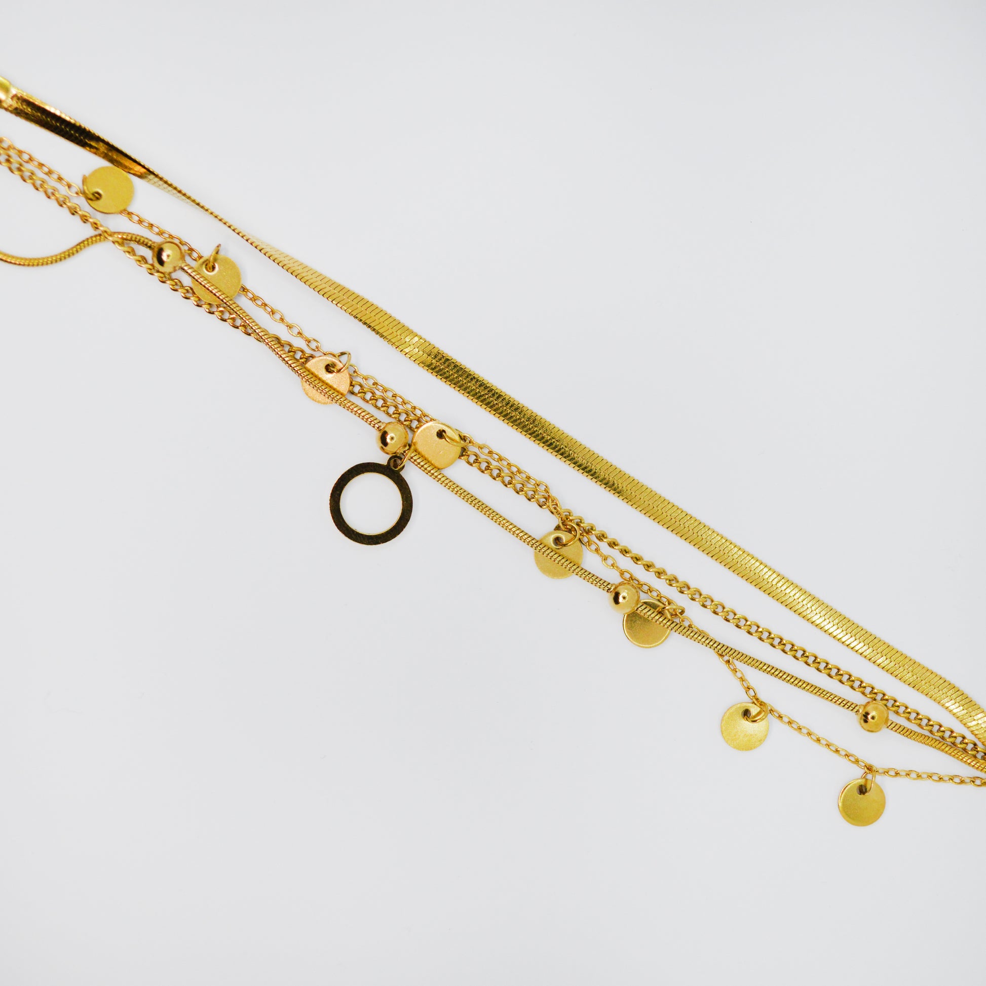 Zlata zapestnica Orbit z več verižicami in okroglimi obeski