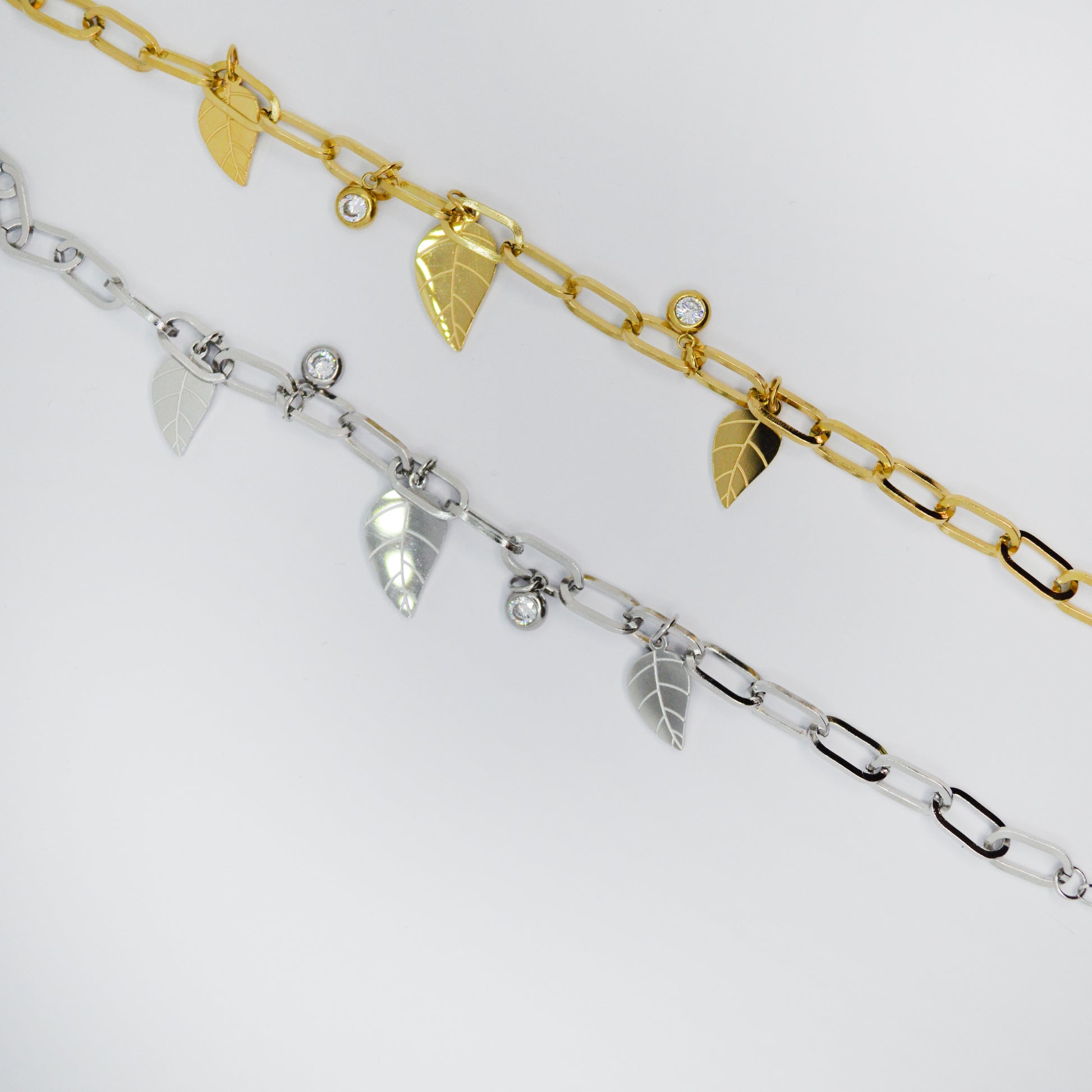 Zapestnici Falling Leaves v zlati in srebrni barvi – minimalističen dizajn z listi