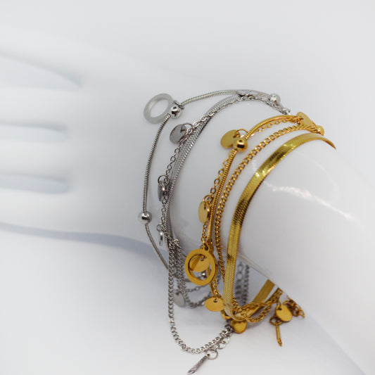 VeÄŤplastna zapestnica Orbit iz nerjaveÄŤega jekla v zlati in srebrni barvi